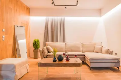 a living room with a couch and a table at NOHO Boutique , premium living Lazeon 7 in Athens