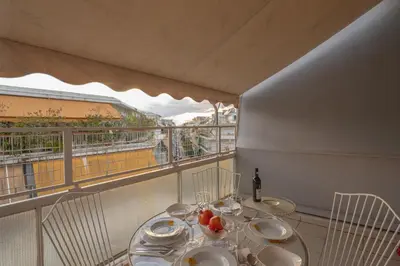 a table with plates of food on a balcony at Plato - Acropolis Residence Apartment in Athens