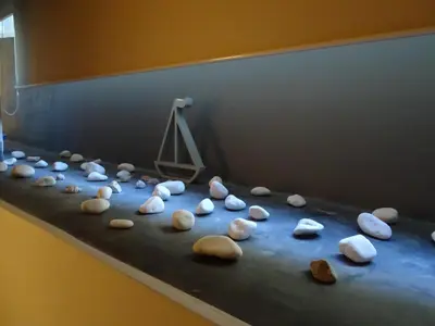 a display of rocks on a table with a scale at Stylish, comfortable, basement loft-like apartment with amenities in Athens