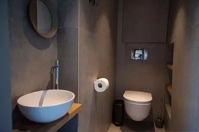 a bathroom with a bowl sink and a toilet at Groovy in Athens