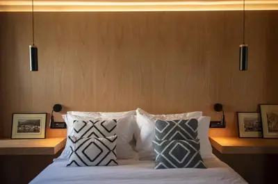 a bedroom with a bed with two pillows at Groovy in Athens