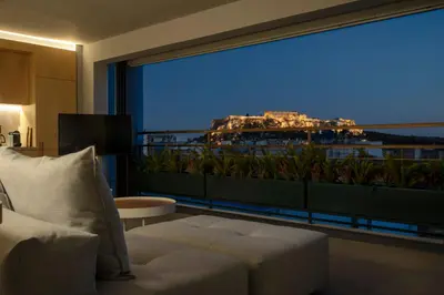a room with a large window with a view of a building at Groovy in Athens