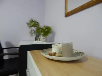 a counter with a bowl of candles and a plate of food at Feels Like Home 2 in Athens