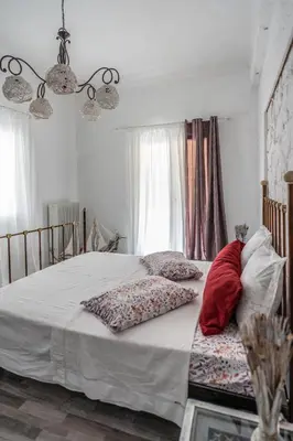 a bedroom with a bed with two pillows on it at Unique Luxury House in Athens
