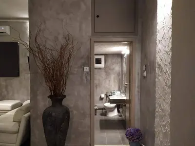 a bathroom with a vase with flowers in it at Unique Luxury House in Athens
