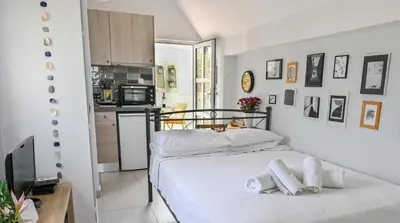 a bedroom with two white towels on a bed at Top of the city Central studio with Acropolis View in Athens