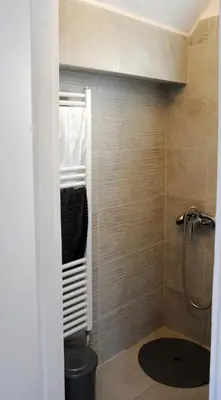 a bathroom with a shower and a toilet in it at Top of the city Central studio with Acropolis View in Athens