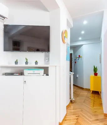 a kitchen with white walls and a yellow cabinet at Martin's Akropolis Studio in Athens