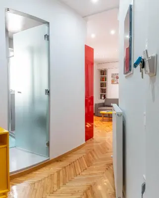 a glass door in a room with a living room at Martin's Akropolis Studio in Athens