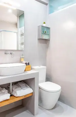 a bathroom with a white toilet and a sink at Martin's Akropolis Studio in Athens