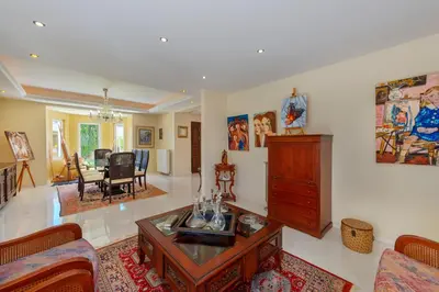 a living room with a couch and a table at The Painters Luxurious villa in Anavissos