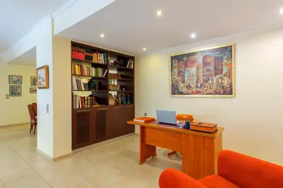 a office with a desk with a laptop on it at The Painters Luxurious villa in Anavissos