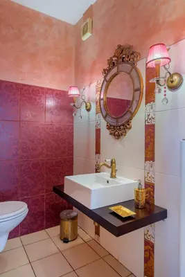 a bathroom with a sink and a mirror at The Painters Luxurious villa in Anavissos