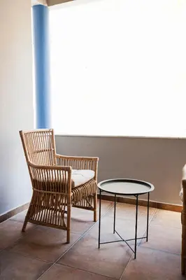 two chairs and a table in a room at Bentzi Boutique Apartment 4 in Athens