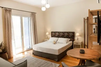 a bedroom with a bed and a large window at Bentzi...Boutique Apartment 6, Superior Suite for 4 Guests in Athens