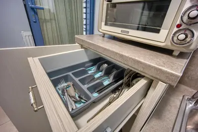 a drawer in a kitchen with a microwave at Bentzi...Boutique Apartment 1, Classic Double with kitchenette, 2 Guests in Athens