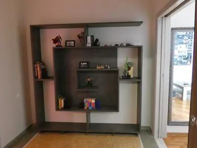 a shelf in the corner of a room at Cinema Lovers in Athens