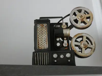a black object with a wheel on a shelf at Cinema Lovers in Athens