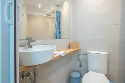 a bathroom with a sink and a toilet at Paris & Helen in Athens