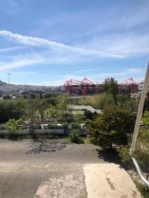 a view of a ballpark with a red building in the background at Metropolitan Complex Suite 2@faliro in Piraeus