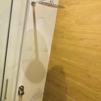 a shadow of a shower in a bathroom at Metropolitan Complex Suite 2@faliro in Piraeus