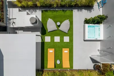 a building with a garden on the side of it at Penthouse with Magical Acropolis view from Balcony in Athens