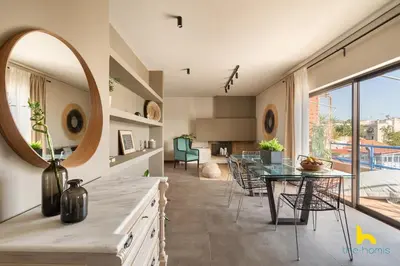 a kitchen with a dining table and a mirror at Penthouse with Magical Acropolis view from Balcony in Athens