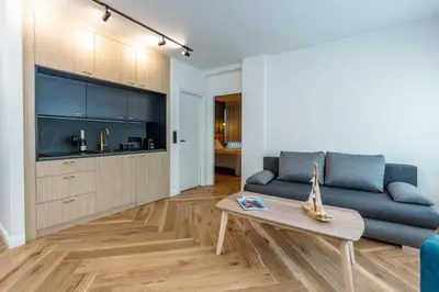 a living room with a couch and a table at Triple A - Prime Location - Between Monastiraki & Syntagma Square-FREE Parking! in Athens
