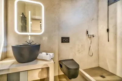 a bathroom with a sink and a mirror at Your Home2b in Paianía