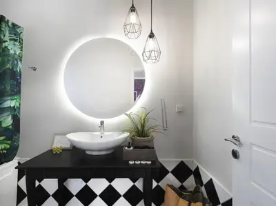 a bathroom with a sink and a mirror at Athenian Apartment in the center with Jacuzzi in Athens