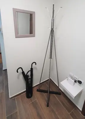 a tripod and umbrella on the floor in a room at WHITE HOUSE 30 steps from the Metro station in Athens
