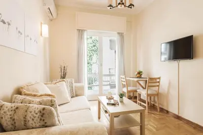 a living room with a couch and a table at La casa di Plaka in Athens