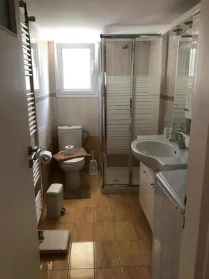 a bathroom with a toilet and a sink at Cosy & Functional pied-à-terre in Athens