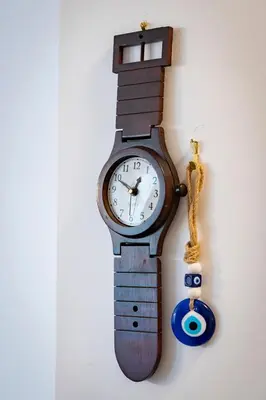 a wooden clock hanging on a wall at Beautifully renovated flat in superb location in Athens