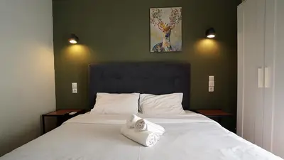 a bedroom with a bed with a towel on it at athens city themis 11 in Athens