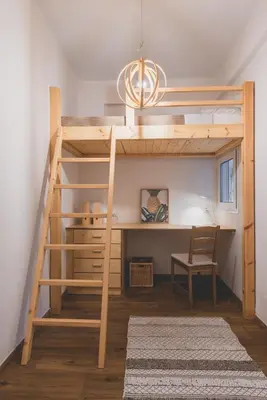 a loft bed with a desk in a room at 90m2 Luxury Apartment in the Heart of Athens - Living Stone Sunstone in Athens