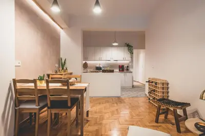 a kitchen and dining room with a table and chairs at 90m2 Luxury Apartment in the Heart of Athens - Living Stone Sunstone in Athens