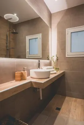 a bathroom with a sink and a mirror at 90m2 Luxury Apartment in the Heart of Athens - Living Stone Sunstone in Athens