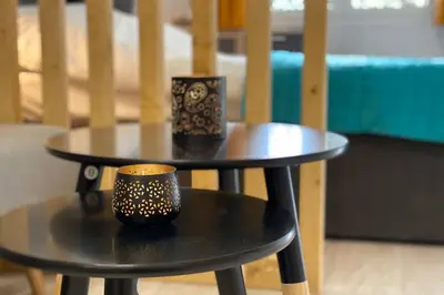 a black table with two cups on top of it at Thissio, Downtown Athens by 'Philoxenia In Athens' in Athens