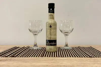 a bottle of wine and two wine glasses on a table at Thissio, Downtown Athens by 'Philoxenia In Athens' in Athens
