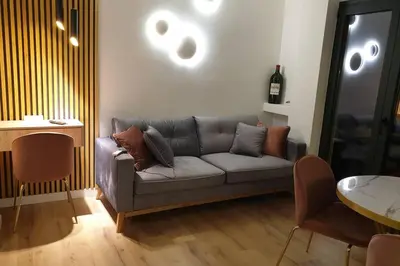a living room with a couch and a table at EcoStay-Serenity,business class apartment by the sea in Alimos Kalamaki in Athens