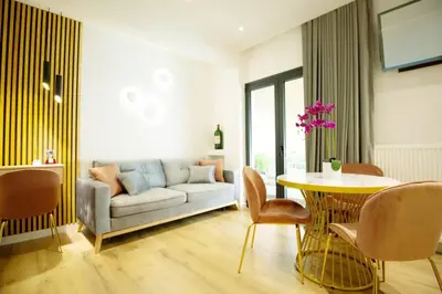 a living room with a couch and a table at EcoStay-Serenity,business class apartment by the sea in Alimos Kalamaki in Athens