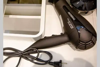 a hairdryer on a white counter next to at EcoStay-Serenity,business class apartment by the sea in Alimos Kalamaki in Athens