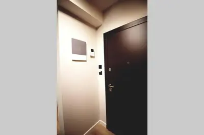 a black door in a room with a hallway at EcoStay-Serenity,business class apartment by the sea in Alimos Kalamaki in Athens