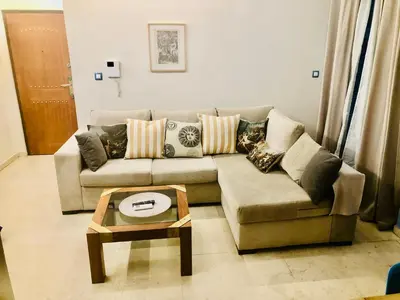a living room with a couch and a coffee table at Piraeus Blue Grand Suite di Giorgio 10 mins from the port. in Piraeus