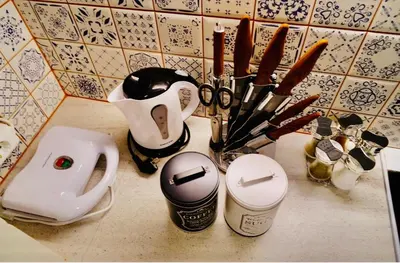 a counter top with a bunch of kitchen utensils at Piraeus Blue Grand Suite di Giorgio 10 mins from the port. in Piraeus