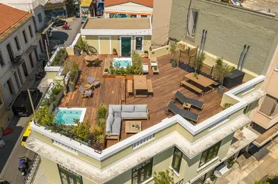 an overhead view of a building with a patio and a pool at Moon And Stars Athens in Athens