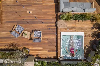 an overhead view of a garden with a pool at Moon And Stars Athens in Athens