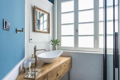 a bathroom with a bowl sink and a window at Moon And Stars Athens in Athens