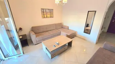 a living room with a couch and a table at Yianna's Apartment in Athens